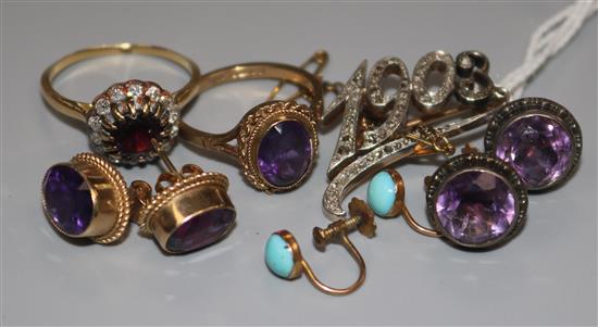 A group of gold mounted jewellery including a diamond set ring and a diamond set 1903 brooch.